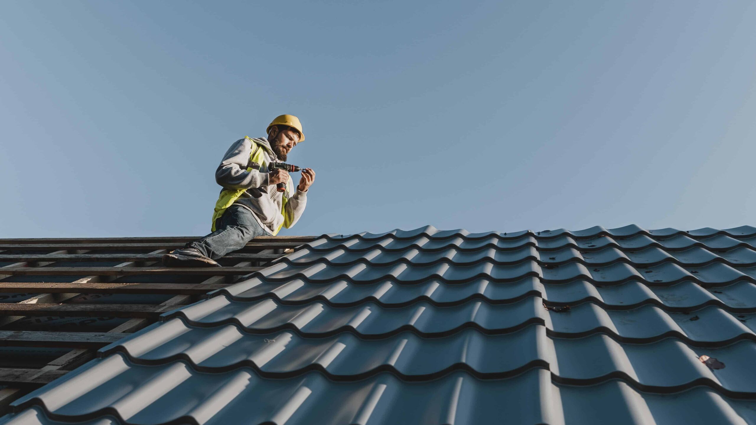 long-shot-man-working-roof(1)
